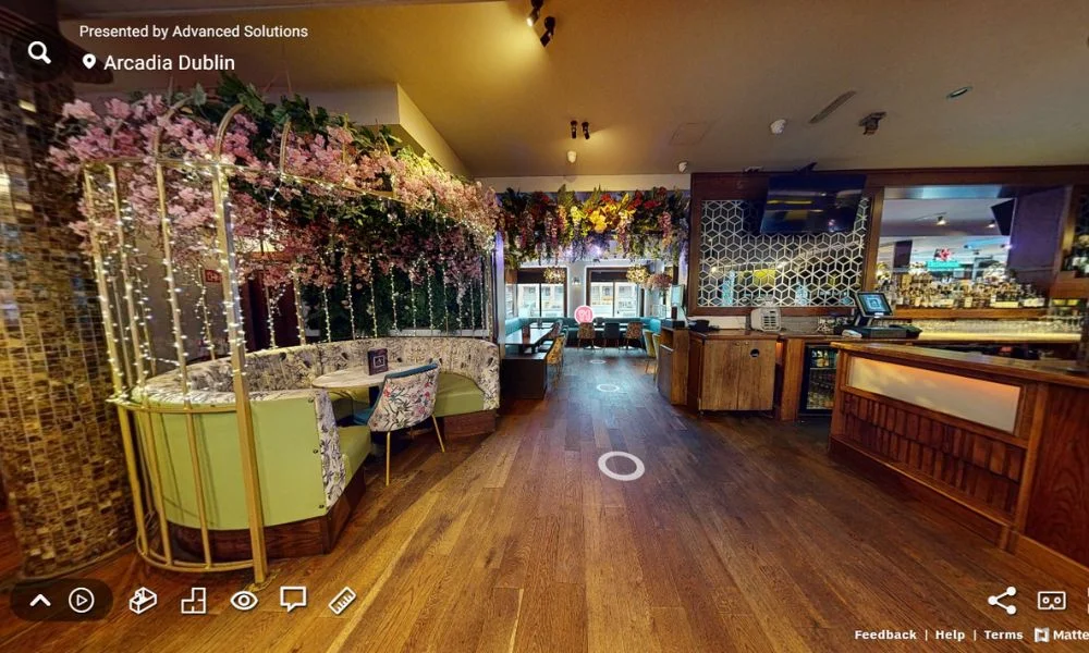 3D Virtual Tour of Arcadia Dublin showcasing the elegant bar interior, floral decor, and cosy seating areas.