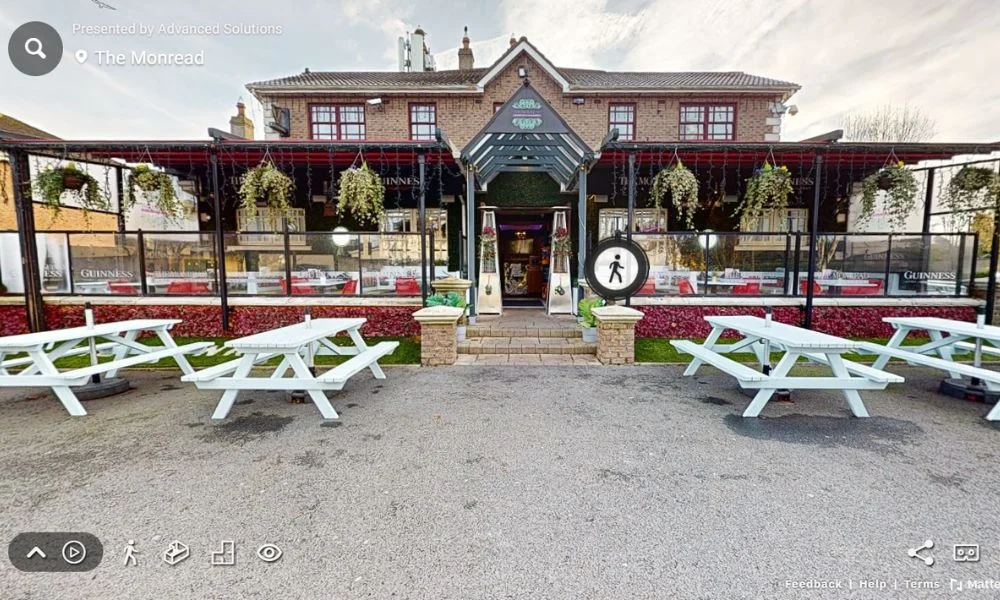 3D Virtual Tour of The Monread showcasing its inviting exterior, outdoor seating area, and charming pub design.